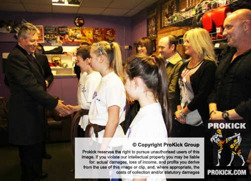 The new ProKick junior Black Belts greeting the First Minister on his visit to ProKick HQ.