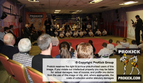 Proud ProKick parents watch on as Northern Ireland First Minister Peter Robinson presents 4 ProKick Kids their Black Belts at ProKick HQ.