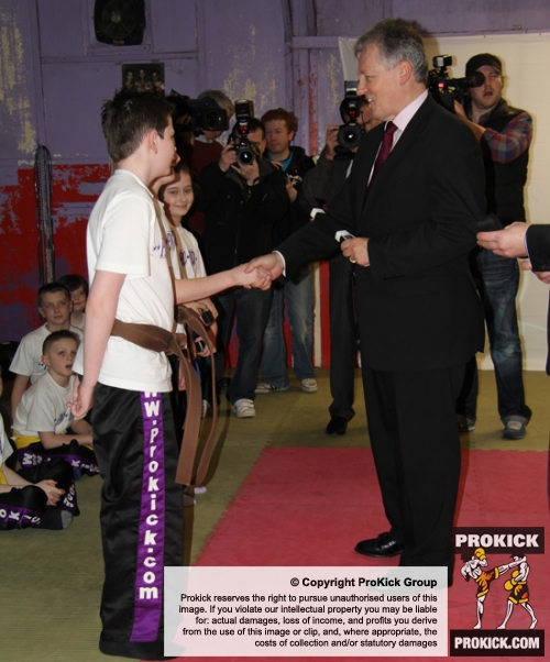 Northern Ireland First Minister Peter Robinson presenting 4 ProKick Kids their Black Belts at ProKick HQ.
