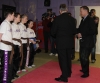 Northern Ireland First Minister Peter Robinson preparing to hand out the black belts to the four recipients.
