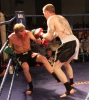 Action from Thai-Tanic Gary Fullerton lands hard knees to Dutch fighter Bo Desselbrine