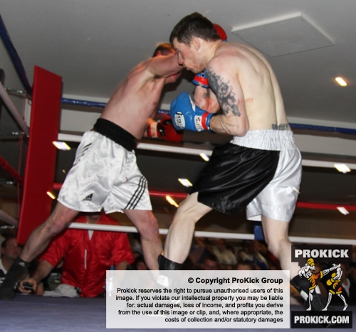 ProKick's Johnny Smith l;ands a counter shot to the body his first competitive boxing match on 25th February 2012 in Staines, Essex.