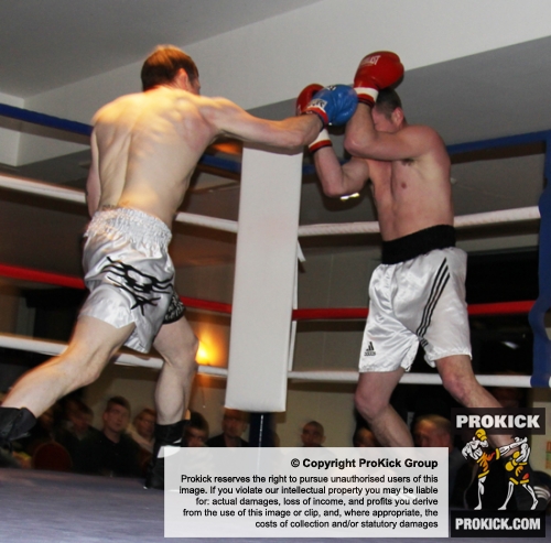 ProKick's Johnny Smith lands a hard right hand to opponent Steve Wilkinson during his first competitive boxing match on 25th February 2012 in Staines, Essex.