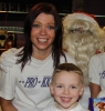 ProKickers (also Mum and Son) Karen and Joseph Millar smiling for a photo with Santa Claus