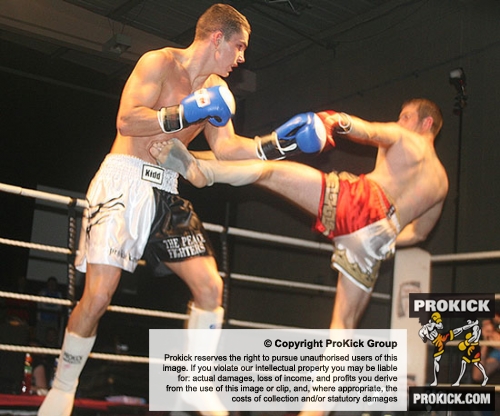 ProKick fighter Karl McBlain takes a hard roundhouse from Bryan Merrigan