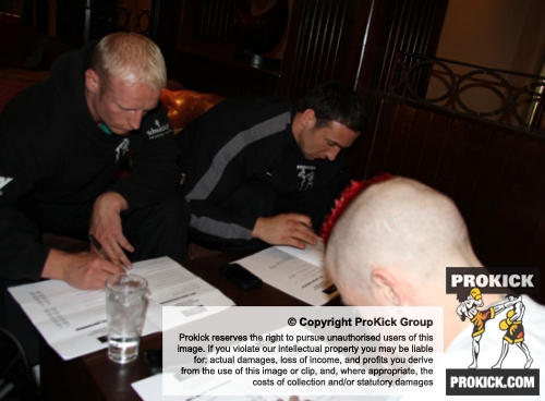ProKick fighters sign their medical clearance forms before the event
