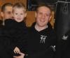 roKick fighter Gary Fullerton smiling for a picture with 5 year old son Cody