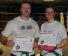 New ProKick Blue Belts Arran Young and Christine Honnor posing happily after a hard grading day at ProKick HQ