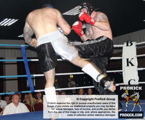 Paul Best lands a thindering low kick to the thigh of John Mullally