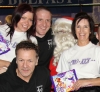 Some of the ProKick team pose for a happy picture alongside Santa Claus after the last ProKick kids class of 2011