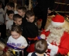 Santa Claus gives out selection boxes to the wave of junior kickboxers