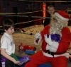Santa Claus gives out a selection box to Travis Madden