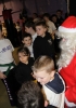 Santa Claus gives out a selection box to a mass of junior ProKick members