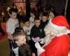 Santa Claus prepares himself for the wave of junior kickboxers that approach to receive their selection boxes