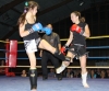 ProKick's Ursula Agnew throws a hard low kick to Swiss opponent Marie-Pierre Limeanstett