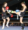 ProKick fighter Ursula Agnew lands a hard front kick on Marie-Pierre Limeanstett