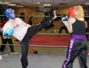 ProKick member and former fighter Anne Gallagher throwing a high kick on the fourth week of ProKick HQ's level 1 sparring course.