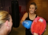 One of ProKick's beginner kickboxing enthusiasts working hard with a member of the senior class.