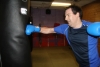 One of ProKick's beginner kickboxing enthusiasts working hard with a member of the senior class.