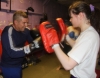 One of ProKick's beginner kickboxing enthusiasts working hard with a member of the senior class.