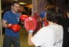 One of ProKick's beginner kickboxing enthusiasts working hard with a member of the senior class.