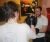 One of ProKick's beginner kickboxing enthusiasts working hard with a member of the senior class