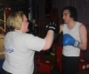 One of ProKick's beginner kickboxing enthusiasts working hard with a member of the senior class.