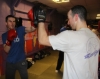 One of ProKick's beginner kickboxing enthusiasts working hard with a member of the senior class.