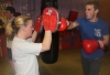 One of ProKick's beginner kickboxing enthusiasts working hard with a member of the senior class.