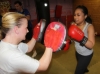 One of ProKick's beginner kickboxing enthusiasts working hard with a member of the senior class