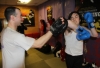 One of ProKick's beginner kickboxing enthusiasts working hard with a member of the senior class.