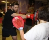 One of ProKick's beginner kickboxing enthusiasts working hard with a member of the senior class.