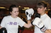 Prokick orange belt Cathryn Greenwood lands an uppercut onto ProKick's European title hopeful Ursula Agnew at last night's sponsored 'spar-a-thon'.