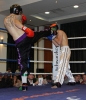 ProKick fighter Darren McMullan lands a powerful roundhouse against Swiss opponent Jeremy Jossi
