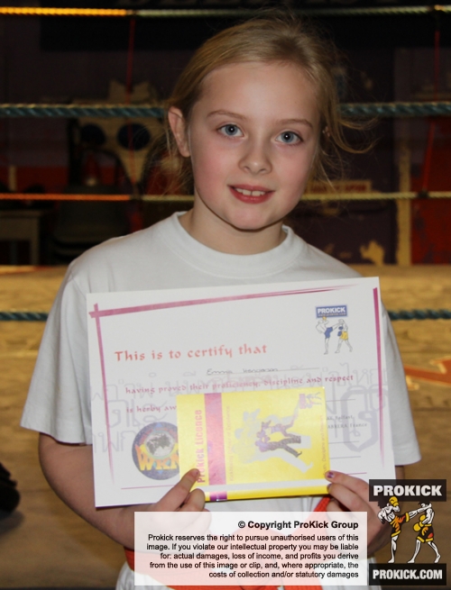 New ProKick Junior Green Belt Emma Henderson smiling with pride after a hard grading day at ProKick HQ