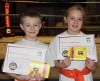 New ProKick Junior Green Belts (also brother and sister) Emma and Jonathan Henderson celebrate together