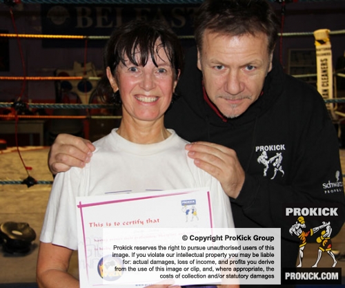 New ProKick Brown Belt Pauline Goody smiles with pride with ProKick Head Coach Billy Murray after a hard grading