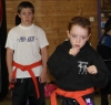 ProKick junior orange belts Joel O'Neill and Jordan Eyre working hard for theur green belt grading.