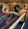 ProKick fighter Johnny Smith lands a hard front kick on Jonathan Curmi of Malta.