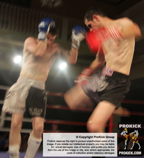 ProKick fighter Johnny Smith slipping a hard low kick from Daryl Orr