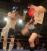 ProKick fighter Johnny Smith slipping a hard low kick from Daryl Orr