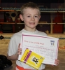 New ProKick Junior Green Belt Jonathan Henderson smiling with pride after a hard grading day at ProKick HQ