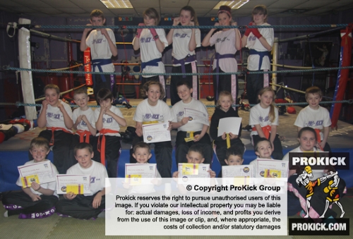 New ProKick Junior Belters smiling with pride after a hard grading day at ProKick HQ