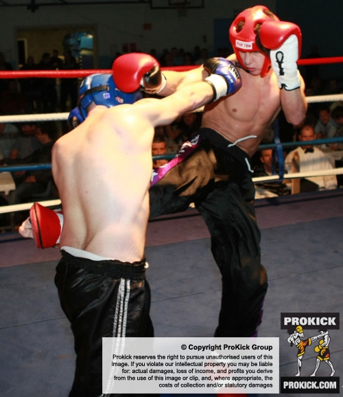 ProKick's Karl McBlain landing a hard, accurate roundhouse kick to the mid-rift of England's Dean Petty