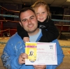 New Orange Belt Morgan Buchanan celebrates with Dad Robert