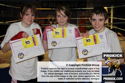 New ProKick Junior Purple Belts Neave, Angel and Kallum O'Brien celebrate after a hard grading day at ProKick HQ