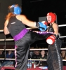 ProKick fighter Stefanie McMullen lands a hard roundhouse to Yvonne McNevin