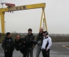 Kickboxing coaches Toni Haberland and Noel Merceica meet 'Goliath' the crane during their tour of the City of Belfast.