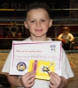 New ProKick Junior Yellow Belt Garyn McAllister smiling with pride after a hard grading day at ProKick HQ