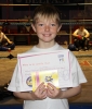 New ProKick Junior Yellow Belt Jay Sturgeon smiling with pride after a hard grading day at ProKick HQ